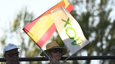 A supporter waves Vox's and Spain's flags as Spanish far-right party Vox' leader Santiago Abascal speaks during a campaign meeting in Guadalajara on July 15, 2023 ahead of July 23 general election. (Photo by OSCAR DEL POZO / AFP) A supporter waves Vox's and Spain's flags as Spanish far-right party Vox' leader Santiago Abascal speaks during a campaign meeting in Guadalajara on July 15, 2023 ahead of July 23 general election. (Photo by OSCAR DEL POZO / AFP)