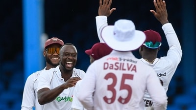 Kemar Roach (2L) and Kraigg Brathwaite (L), of West Indies, celebrate (AFP) Kemar Roach (2L) and Kraigg Brathwaite (L), of West Indies, celebrate (AFP)