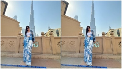 Mouni looked gorgeous in a white cropped top, teamed with a blue and white patterned shrug and matching flared trousers. (Instagram/@imouniroy) Mouni looked gorgeous in a white cropped top, teamed with a blue and white patterned shrug and matching flared trousers. (Instagram/@imouniroy)