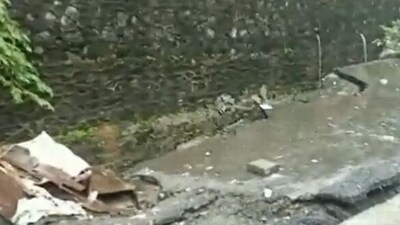 Road caved in near IT Park in Goregaon East (ANI)