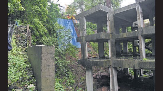 “For the past two years, the hill has witnessed massive excavation. As a result, the soil around the sides of the temple has loosened, leading to the fear of another landslide,” Mhatre said. “In 2018, I renovated the temple using my funds, but due to the digging work, the area has suffered a lot of damage. Even the stairways leading to the temple were destroyed.” (Bachchan Kumar/ HT PHOTO)
