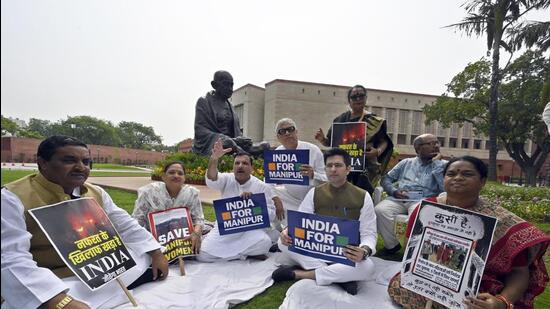 Opposition members during a sit-in protest at Parliament House Complex, in New Delhi on Tuesday. (Sanjeev Verma/HT photo)