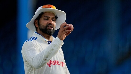 India's captain Rohit Sharma eyes the ball after hiting a six from a delivery of West Indies' Alzarri Joseph on day four of their second cricket Test match (AP)