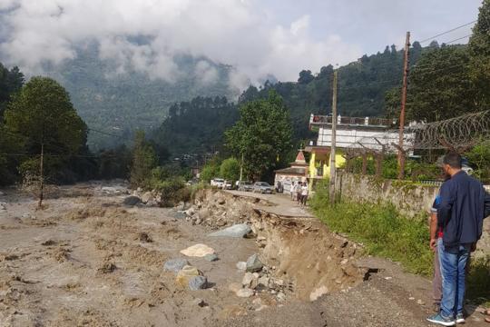 Residents taking a look at what remains of the road to their village in Gadsa Valley of Kullu district on Tuesday. (Aqil Khan/HT) Residents taking a look at what remains of the road to their village in Gadsa Valley of Kullu district on Tuesday. (Aqil Khan/HT)