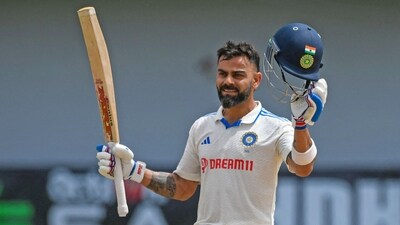 Virat Kohli raises his bat as he celebrates his century (BCCI Twitter) Virat Kohli raises his bat as he celebrates his century (BCCI Twitter)