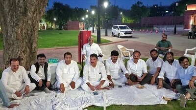 Aam Aadmi Party (AAP) MP Sanjay Singh with Opposition MPs continues the protest at the Parliament premises over his suspension for the current Monsoon Session, in New Delhi on Tuesday. (ANI Photo)