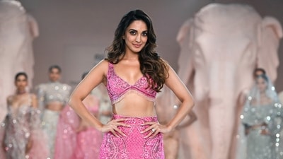 Kiara Advani's dress comprises a top with a plunging neckline and a skirt with a high slit and long train at the back. (ANI) Kiara Advani's dress comprises a top with a plunging neckline and a skirt with a high slit and long train at the back. (ANI)