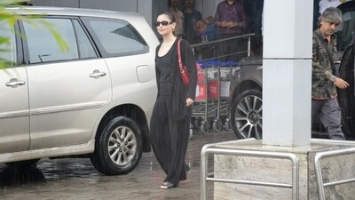 Alia wore the blouse with a matching black cardigan featuring a ribbed design, an open front with button closures, full-length sleeves, droopy shoulders, and a relaxed fitting. She completed the look with black pants featuring a high-rise waistline, a flared design, and a below-the-ankle hem length. (Instagram) Alia wore the blouse with a matching black cardigan featuring a ribbed design, an open front with button closures, full-length sleeves, droopy shoulders, and a relaxed fitting. She completed the look with black pants featuring a high-rise waistline, a flared design, and a below-the-ankle hem length. (Instagram)