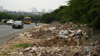 Construction and demolition waste on both sides of the Gurugram-Faridabad Road near Khushboo Chowk in Gurugram on Tuesday. (Parveen Kumar/HT Photo) Construction and demolition waste on both sides of the Gurugram-Faridabad Road near Khushboo Chowk in Gurugram on Tuesday. (Parveen Kumar/HT Photo)