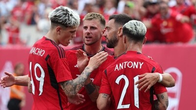 Bruno Fernandes #8 of Manchester United celebrates his goal with Antony #21 of Manchester United against Arsenal during their Pre-Season friendly match (Getty Images via AFP) Bruno Fernandes #8 of Manchester United celebrates his goal with Antony #21 of Manchester United against Arsenal during their Pre-Season friendly match (Getty Images via AFP)
