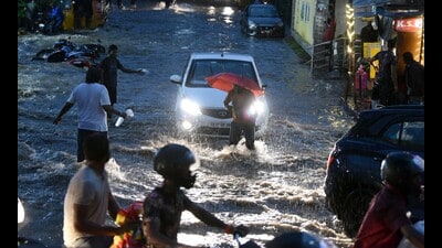 People wade through the waterlogged street amid heavy rainfall, at Malakpet, in Hyderabad on July 24, 2023. (ANI) People wade through the waterlogged street amid heavy rainfall, at Malakpet, in Hyderabad on July 24, 2023. (ANI)