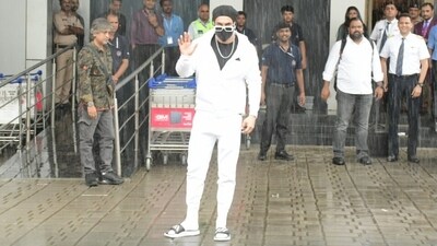 Meanwhile, Ranveer Singh arrived at the airport in a monochrome outfit, dressed head-to-toe in Adidas (he is the brand ambassador of the label). Ranveer wore a black crew-neck T-shirt and layered it with a white hooded jacket featuring a front zip closure, full-length sleeves, and a cinched hem and cuffs. Lastly, matching white joggers completed the airport look. (Instagram) Meanwhile, Ranveer Singh arrived at the airport in a monochrome outfit, dressed head-to-toe in Adidas (he is the brand ambassador of the label). Ranveer wore a black crew-neck T-shirt and layered it with a white hooded jacket featuring a front zip closure, full-length sleeves, and a cinched hem and cuffs. Lastly, matching white joggers completed the airport look. (Instagram)