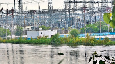 The flooded 220kv electricity sub-station in Morti in Ghaziabad on Tuesday. If the 220kv sub-station is shut down, half of Ghaziabad may lose power, officials said. (Sakib Ali/HT Photo)