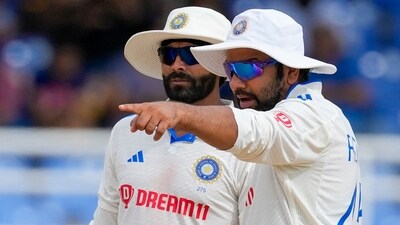 India's captain Rohit Sharma, right, talks to bowler Ravindra Jadeja (AP) India's captain Rohit Sharma, right, talks to bowler Ravindra Jadeja (AP)