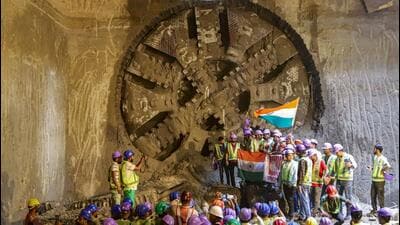 Workers celebrate after completing the tunnelling in the Delhi-Ghaziabad-Meerut Regional Rapid Transit System (RRTS) project’s underground section in Meerut on Tuesday. (PTI)