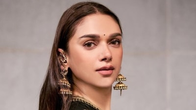 Aditi Rao Hydari's double-layered jhumkas can elevate any look. They come in a rustic golden color with intricate detailing and designs that elegantly cover her entire ear. The jhumkas gracefully cascade down her shoulders, adding an enchanting and elegant touch. (Instagram/@aditiraohydari) Aditi Rao Hydari's double-layered jhumkas can elevate any look. They come in a rustic golden color with intricate detailing and designs that elegantly cover her entire ear. The jhumkas gracefully cascade down her shoulders, adding an enchanting and elegant touch. (Instagram/@aditiraohydari)