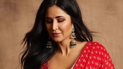 When it comes to style and fashion, the stunning Katrina Kaif is undoubtedly a trendsetter. For her red saree look, Katrina paired it with statement-making long golden jhumkas adorned with green emeralds at the bottom, creating a perfect and eye-catching combination. (Instagram/@katrinakaif) When it comes to style and fashion, the stunning Katrina Kaif is undoubtedly a trendsetter. For her red saree look, Katrina paired it with statement-making long golden jhumkas adorned with green emeralds at the bottom, creating a perfect and eye-catching combination. (Instagram/@katrinakaif)
