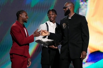 Los Angeles Lakers' LeBron James, right, accepts the award for best record-breaking performance from his sons, Bronny James, left, and Bryce James, at the ESPY awards July 12, 2023, in Los Angeles. Bronny James was hospitalized in stable condition Tuesday, July 25, 2023, a day after going into cardiac arrest while participating in a practice at the University of Southern California, a family spokesman said. (AP Photo/Mark J. Terrill) (AP) Los Angeles Lakers' LeBron James, right, accepts the award for best record-breaking performance from his sons, Bronny James, left, and Bryce James, at the ESPY awards July 12, 2023, in Los Angeles. Bronny James was hospitalized in stable condition Tuesday, July 25, 2023, a day after going into cardiac arrest while participating in a practice at the University of Southern California, a family spokesman said. (AP Photo/Mark J. Terrill) (AP)