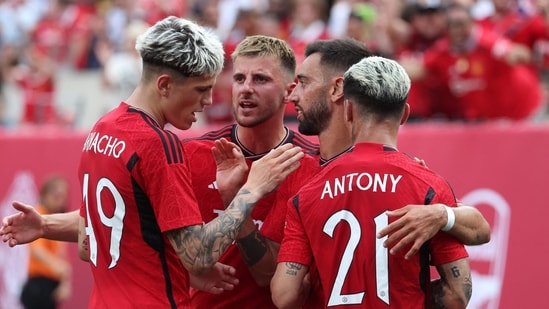 Bruno Fernandes #8 of Manchester United celebrates his goal with Antony #21 of Manchester United against Arsenal during their Pre-Season friendly match (Getty Images via AFP)