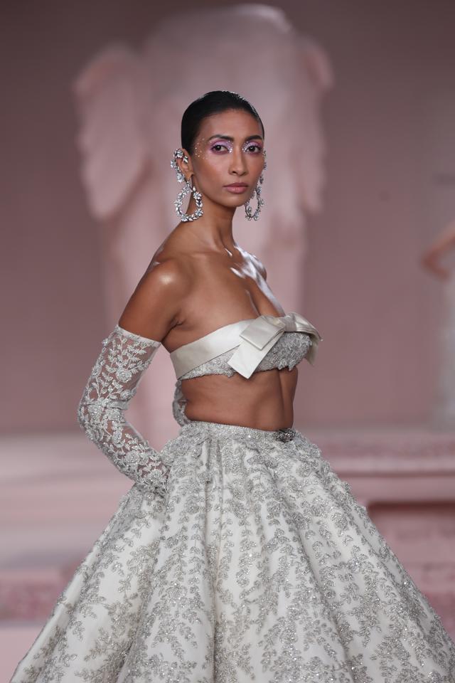 Model Lakshmi Rana looked beguiling in a fully embroidered lehenga with a bandeau blouse from Falguni Shane Peacock.