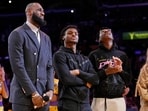 FILE - Los Angeles Lakers forward LeBron James, second from left, Bronny James, center, and Bryce James FILE - Los Angeles Lakers forward LeBron James, second from left, Bronny James, center, and Bryce James