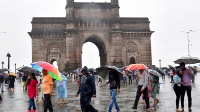 People enjoy a rainy afternoon at Gateway of India as the maximum city received heavy rainfall in Mumbai, (Photo by Bhushan Koyande/HT) People enjoy a rainy afternoon at Gateway of India as the maximum city received heavy rainfall in Mumbai, (Photo by Bhushan Koyande/HT)