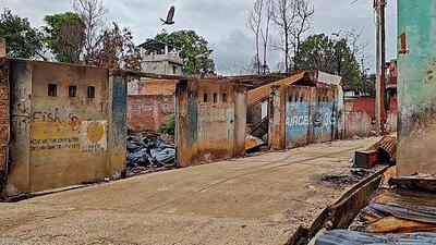 An area where a mob set afire at least 30 houses and shops in Moreh on Thursday. (PTI) An area where a mob set afire at least 30 houses and shops in Moreh on Thursday. (PTI)