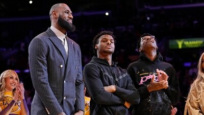 FILE - Los Angeles Lakers forward LeBron James, second from left, Bronny James, center, and Bryce James (AP) FILE - Los Angeles Lakers forward LeBron James, second from left, Bronny James, center, and Bryce James (AP)