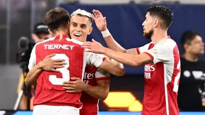 Arsenal's Leandro Trossard (C) celebrates scoring his team's fourth goal during a pre-season friendly against Barcelona (AFP) Arsenal's Leandro Trossard (C) celebrates scoring his team's fourth goal during a pre-season friendly against Barcelona (AFP)