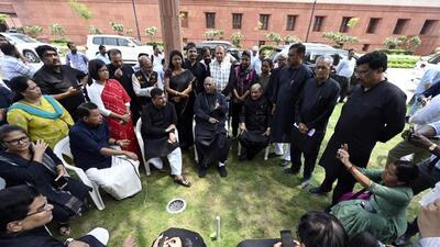 Leader of Opposition in the Rajya Sabha Mallikarjun Kharge and other opposition MPs dressed in black, at the Parliament complex in Delhi on Thursday. (Sanjeev Verma/HT) Leader of Opposition in the Rajya Sabha Mallikarjun Kharge and other opposition MPs dressed in black, at the Parliament complex in Delhi on Thursday. (Sanjeev Verma/HT)