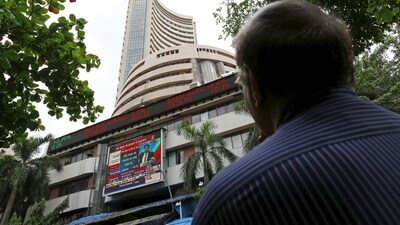 A man looks at a screen across a road displaying the Sensex on the facade of the Bombay Stock Exchange (BSE) building in Mumbai, India. (File image) (REUTERS)