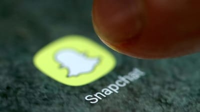The Snapchat app logo is seen on a smartphone (REUTERS)