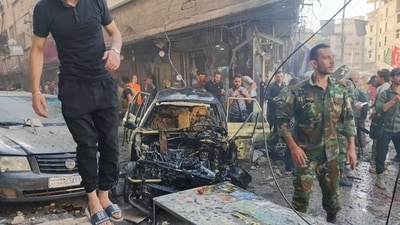 This image shows people gathering at the site of an explosion in the town of Sayyida Zeinab on the outskirts of Damascus. (AFP) This image shows people gathering at the site of an explosion in the town of Sayyida Zeinab on the outskirts of Damascus. (AFP)