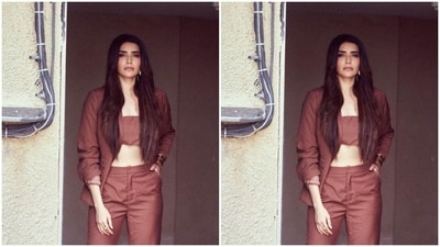 Karishma decked up in a maroon cropped top and layered it with a matching blazer and a pair of maroon formal trousers. (Instagram/@karishmaktanna) Karishma decked up in a maroon cropped top and layered it with a matching blazer and a pair of maroon formal trousers. (Instagram/@karishmaktanna)