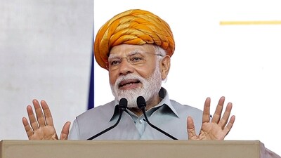 Prime Minister Narendra Modi addresses a public meeting during the inauguration of multiple development projects, in Rajkot, Thursday. (PTI) Prime Minister Narendra Modi addresses a public meeting during the inauguration of multiple development projects, in Rajkot, Thursday. (PTI)