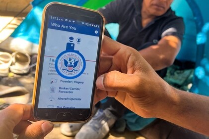 A migrant shows the CBP One App from the US Customs and Border Protection agency, to use to apply for an appointment to claim asylum, on a phone in Ciudad Juarez, Chihuahua state, Mexico, on May 10, 2023. The US on May 11, 2023, will officially end its 40-month Covid-19 emergency, also discarding the Title 42 law, a tool that has been used to prevent millions of migrants from entering the country. (Photo by Gilles CLARENNE / AFP) (AFP) A migrant shows the CBP One App from the US Customs and Border Protection agency, to use to apply for an appointment to claim asylum, on a phone in Ciudad Juarez, Chihuahua state, Mexico, on May 10, 2023. The US on May 11, 2023, will officially end its 40-month Covid-19 emergency, also discarding the Title 42 law, a tool that has been used to prevent millions of migrants from entering the country. (Photo by Gilles CLARENNE / AFP) (AFP)