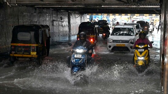 Vehicles wade through waterlogged streets on Subway at Andheri, amid monsoon rains, in Mumbai. (Photo by Vijay Bate/HT Photo)