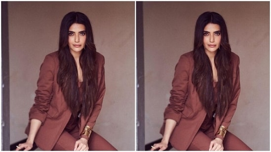Karishma looked gorgeous in a maroon pant suit as she posed for the pictures like a diva.&nbsp;(Instagram/@karishmaktanna)