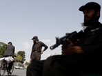 Taliban soldiers stand guard at a checkpoint in Kabul, Afghanistan, July 6. 