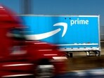 FILE PHOTO: An Amazon Prime truck is pictured as it crosses the George Washington Bridge on Interstate Route 95 during Amazon's two-day "Prime Early Access Sale" shopping event for Amazon members in New York City, New York, U.S., October 11, 2022. REUTERS/Mike Segar/File Photo