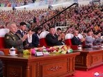 North Korean leader Kim Jong Un (C), with Chinese Communist Party politburo member Li Hongzhong (4th R) and Russian Defence Minister Sergei Shoigu (L), attending the parade.