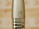 The Paris 2024 Olympic torch is pictured on the stage 