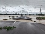 A partially damaged road is seen submerged in the floodwaters of the swollen Godavari River, in Bhupalpally. 