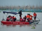 Rescuers search for missing passengers from a boat that capsized in Binangonan, Rizal province, Philippines