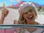 Margot Robbie in Barbie (left) and Cillian Murphy in a still from Oppenheimer.
