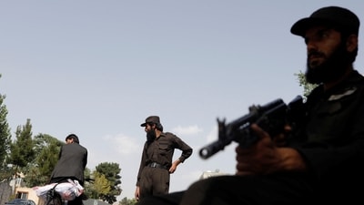 Taliban soldiers stand guard at a checkpoint in Kabul, Afghanistan, July 6. (REUTERS)