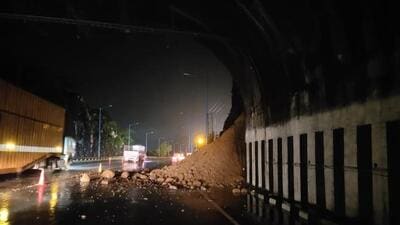 According to the state highway police, traffic was disrupted due to landslides on the Mumbai-bound lane of the Pune-Mumbai Expressway at around 8:15 pm on Thursday. The expressway was closed for traffic from 2pm to 4:40 pm to clear loose boulders near Kamshet tunnel on Friday. (HT)