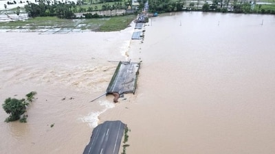 An aerial view of a partially damaged road submerged in the floodwaters of the swollen Godavari, in Bhupalpally district of Telangana. (PTI) An aerial view of a partially damaged road submerged in the floodwaters of the swollen Godavari, in Bhupalpally district of Telangana. (PTI)