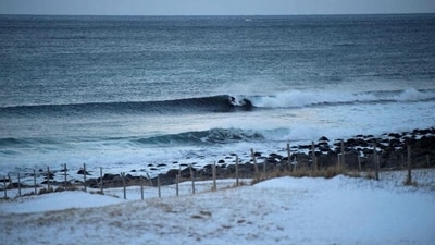 A surfer rides a wave at Unstad along the northern Atlantic Ocean. (Olivier Morin/AFP)