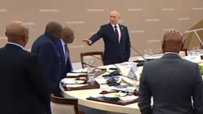 Russian President Vladimir Putin urging Comoros President to keep sitting after a protocol breach during an official meet. (Twitter) Russian President Vladimir Putin urging Comoros President to keep sitting after a protocol breach during an official meet. (Twitter)